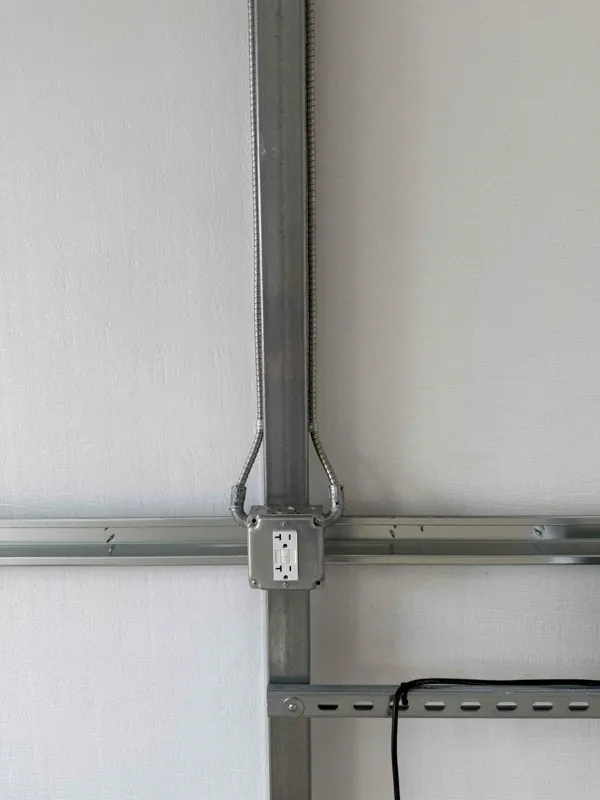 A GFCI receptacle in a metal box in a metal framed shed.
