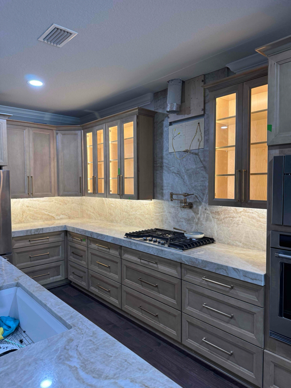 Under cabinet and interior cabinet lighting in a kitchen.