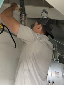 Electrical apprentice working on a job site.