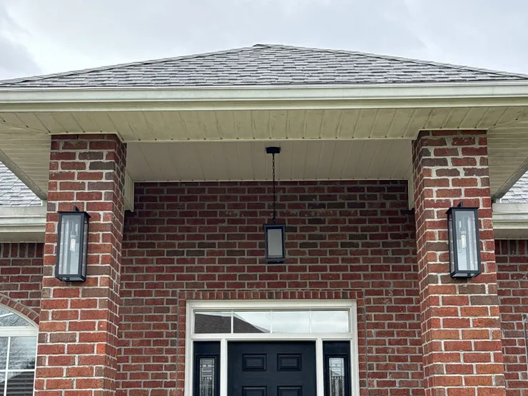 A pendant light installed on a front porch.