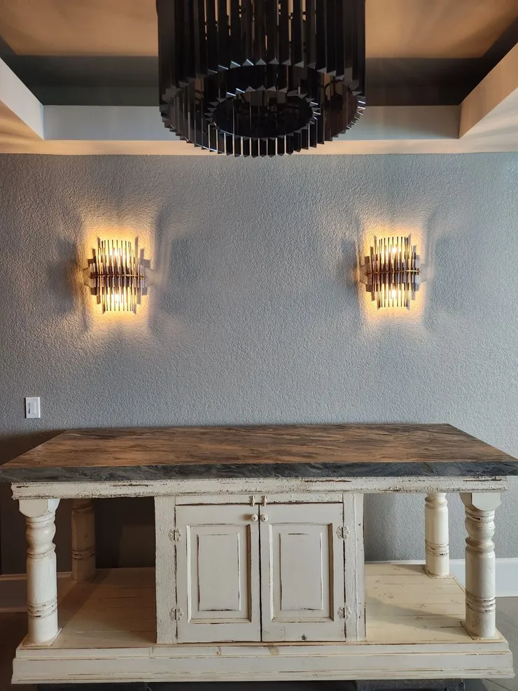 Two sconce light fixtures installed on a wall in a condo on Pensacola Beach, FL.