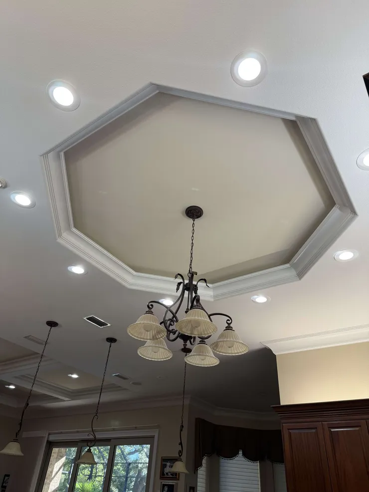 Recessed lighting installed in the ceiling in the kitchen.