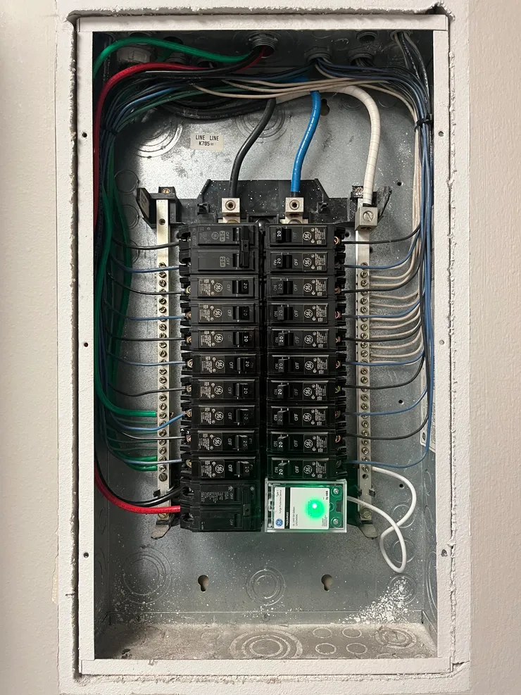 An electrical sub-panel containing the breaker for an EV charger circuit.