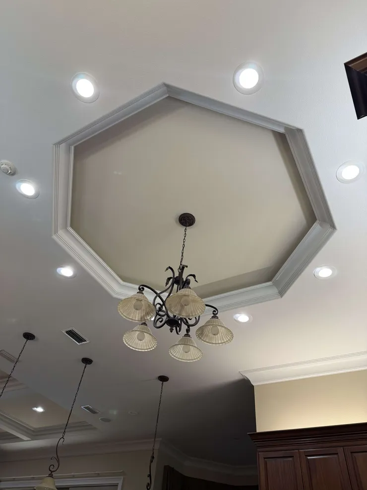 Recessed lighting installed in the kitchen ceiling.