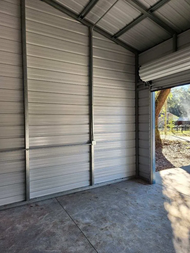 Electrical conduit and receptacle installed in a metal shed.