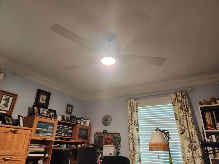A ceiling fan replacement installed in a home office.