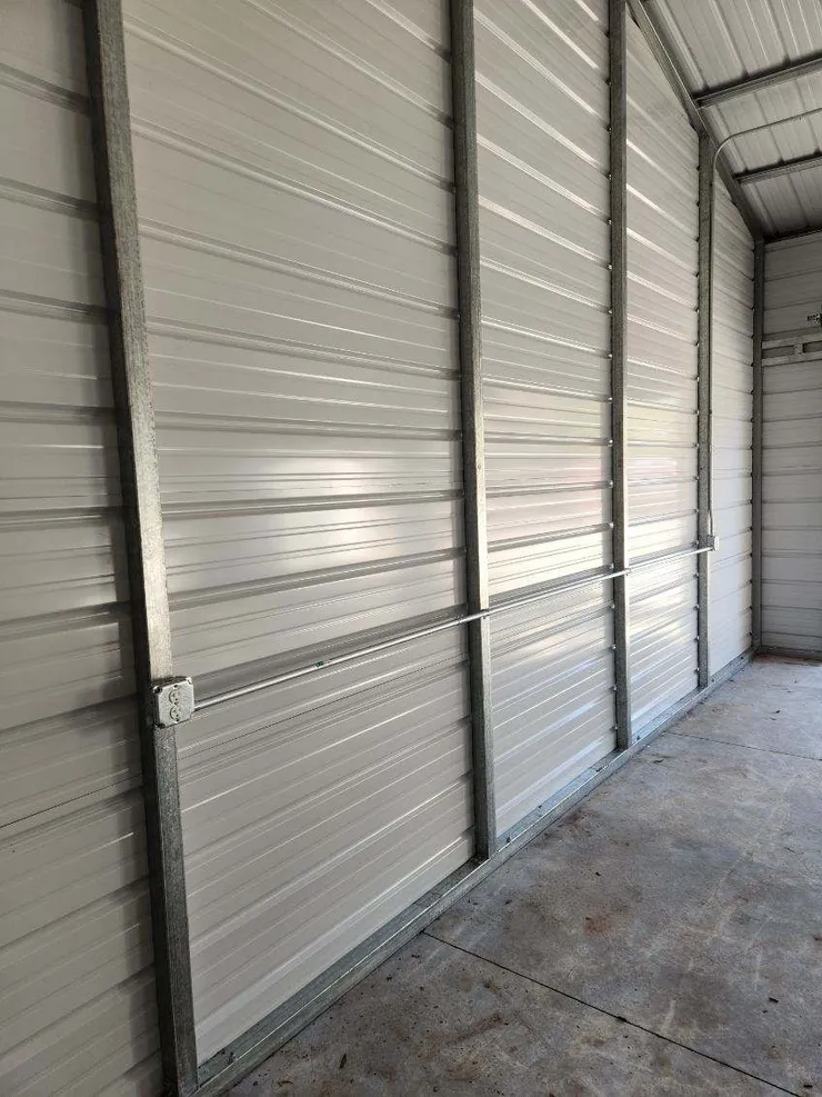 Electrical receptacle and conduit installed in a metal shed.