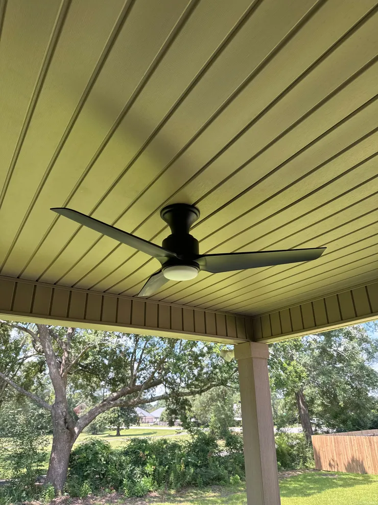 A ceiling fan installed in a patio in Cantonment, FL.