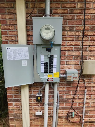 Main service panel replacement with portable generator interlock connection.