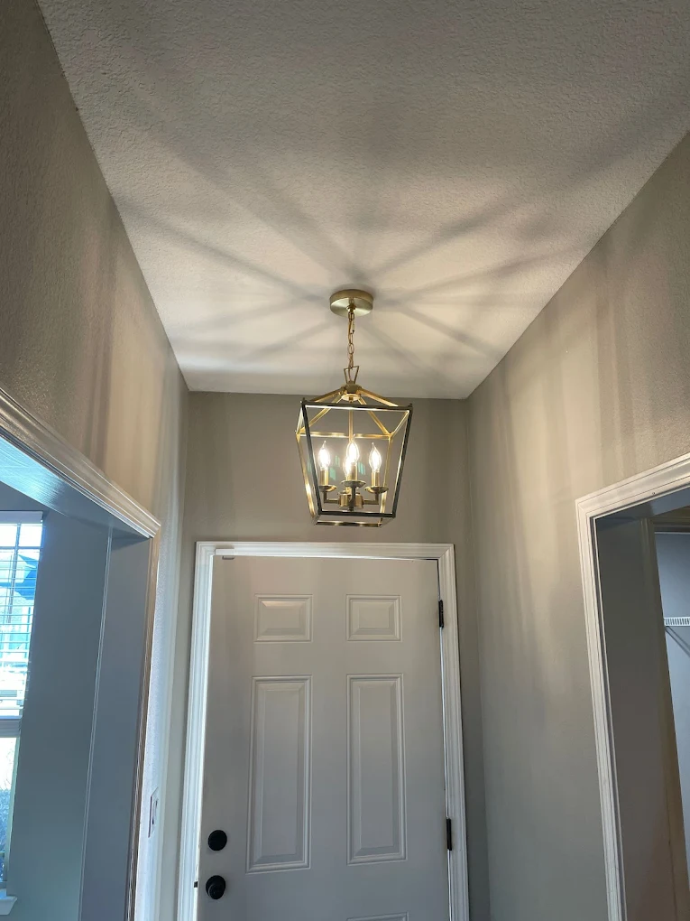 Modern farmhouse lantern pendant style foyer light fixture.