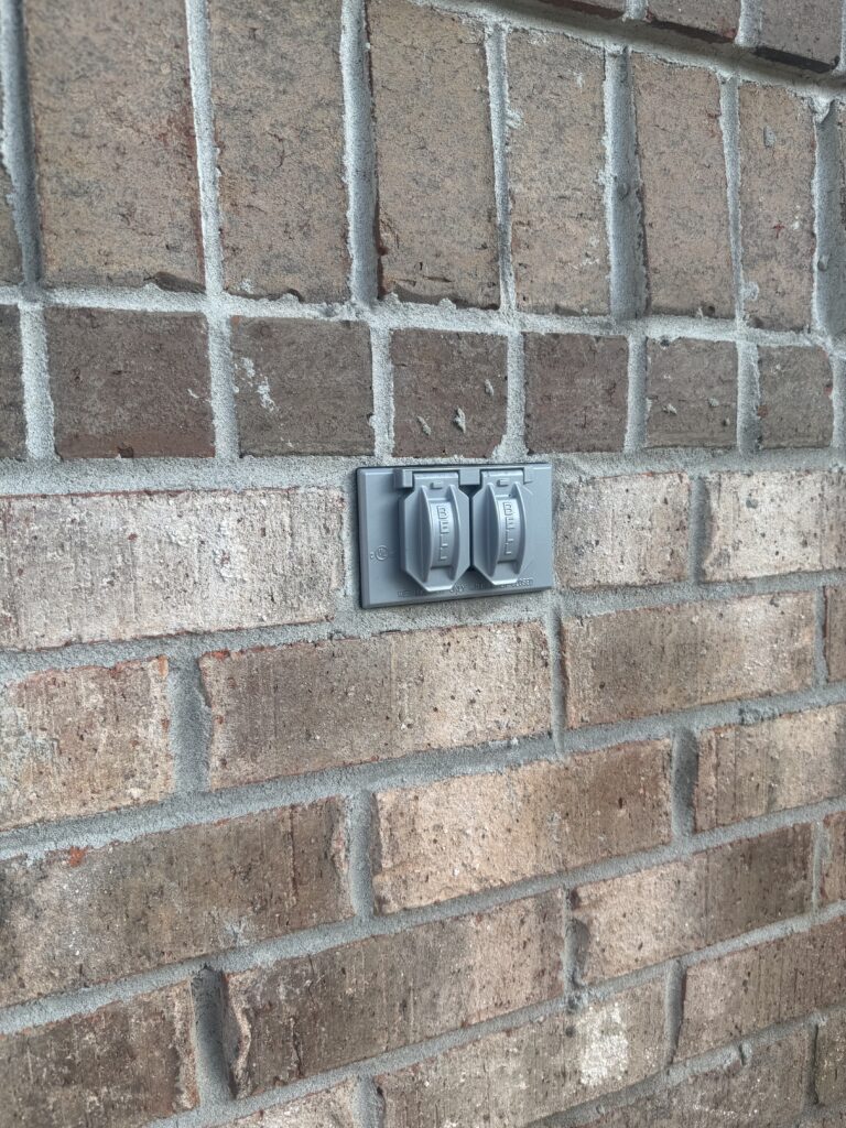 Weather resistant cover on an outdoor receptacle.