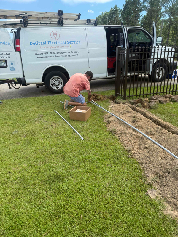 Electrician working on conduit run.